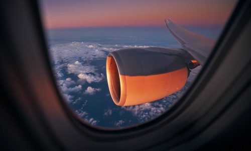 View from window of airplane during flight above ocean